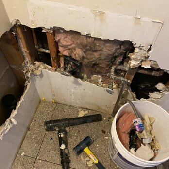 Wall opened to remove failed stack sections